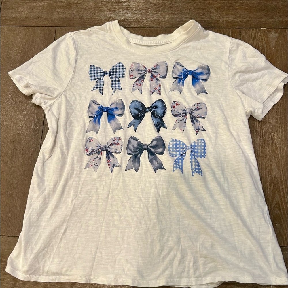 Cato White Tee with Blue and Gray Bow Patterns